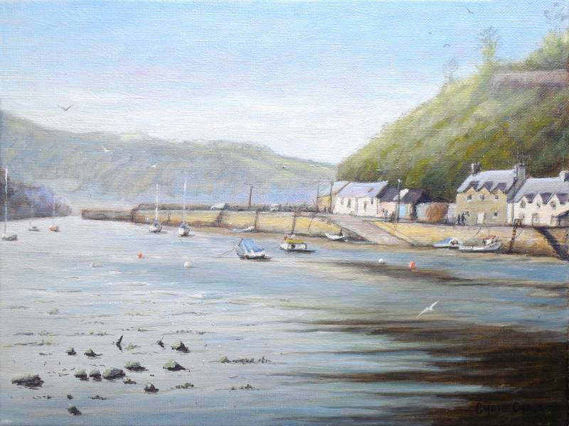 A oil painting of Fishguard lower harbour in Pembrokeshire with fishing boats and very old houses