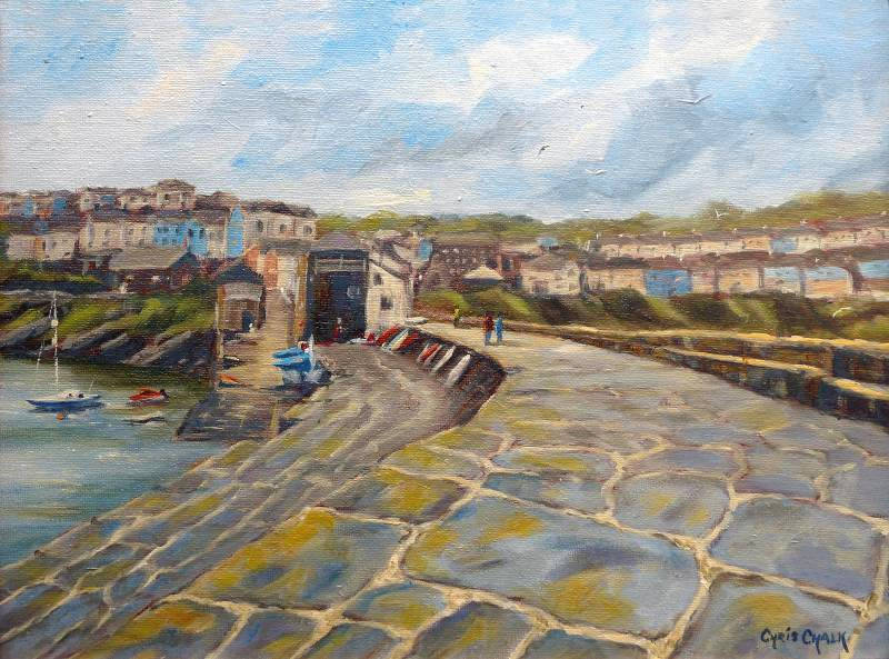 A painting of New Quay looking along the pier towards the town in Ceredigion west Wales